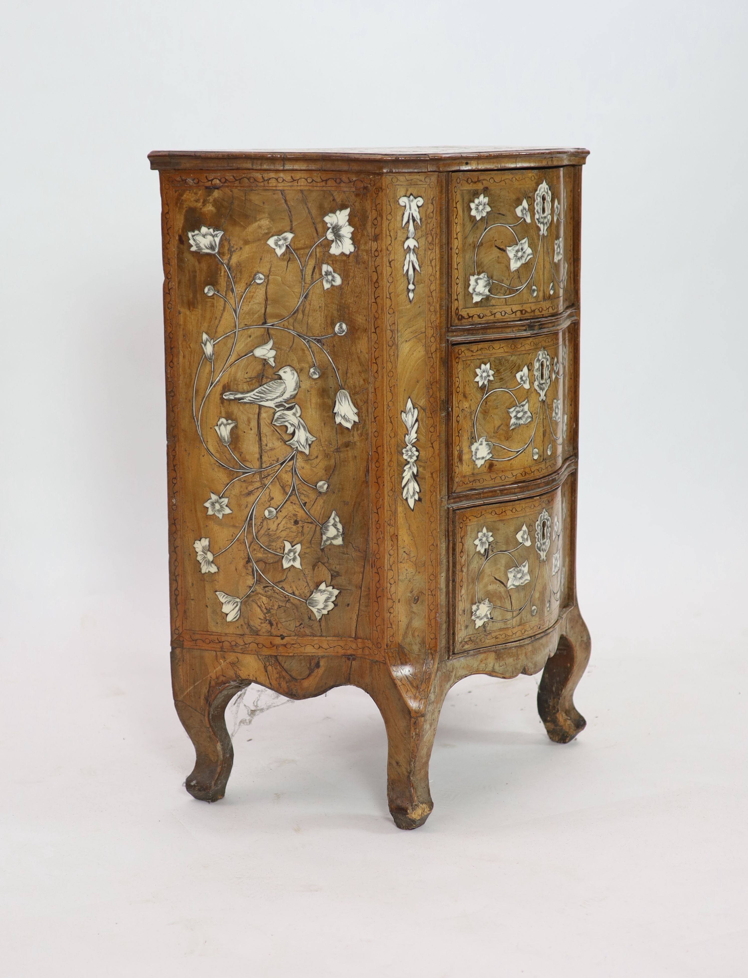 A mid 18th century North Italian marquetry inlaid walnut serpentine commode, W 60cm D 36cm H 78cm